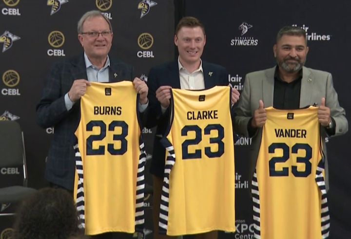 James Burns, Reed Clarke and Tank Vander pose for a photo at a news conference at the Edmonton Expo Centre on Feb. 23, 2023. The three men have formed a partnership called the Stingers Entertainment Group and bought the Edmonton Stingers basketball team from the CEBL.