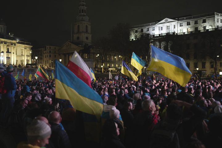 People attend a vigil at the Trafalgar Square organized by the Ukrainian and U.S. embassies, ahead of the one-year anniversary of the invasion of Ukraine, in London, Thursday, Feb. 23, 2023.
