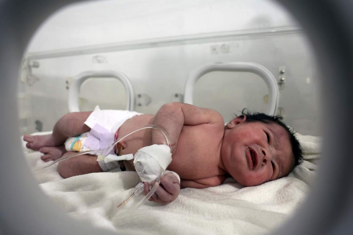 Baby found in Syria earthquake rubble is seen in an incubator