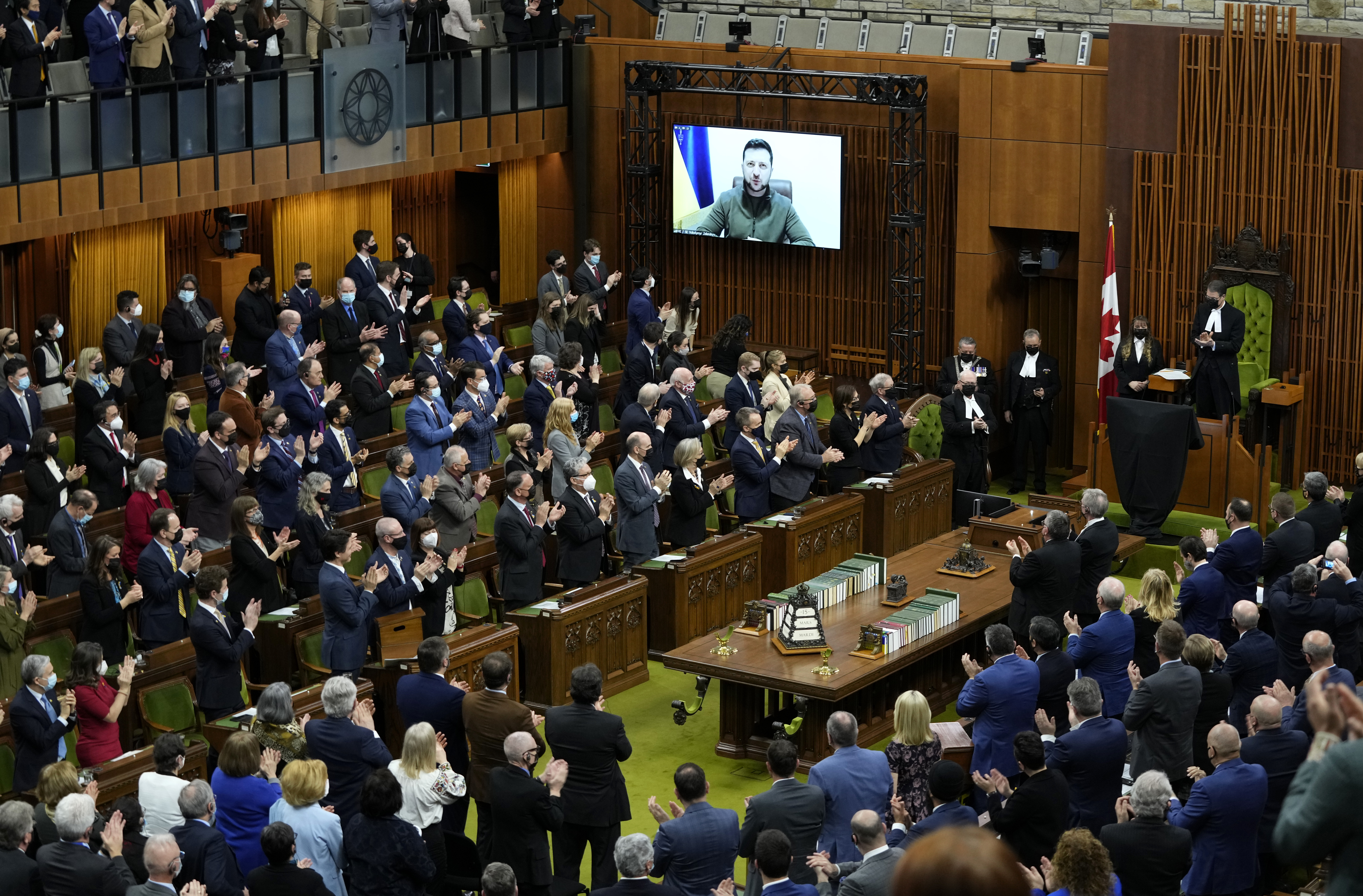 Canadian MPs give a standing ovation to the Ukrainian president during a speech.