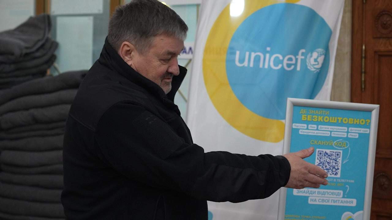 Kyiv station manager Leonid Loboyko points out supplies donated by Unicef for the comfort of evacuees.