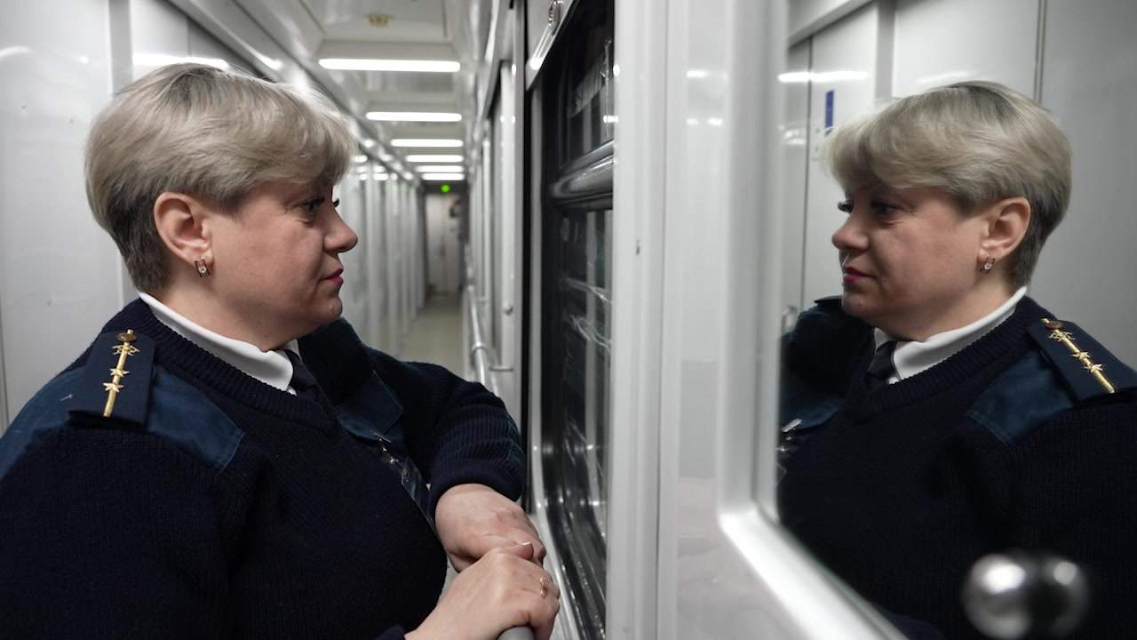 Train manager Lilia Semenova during a moment of reflection.