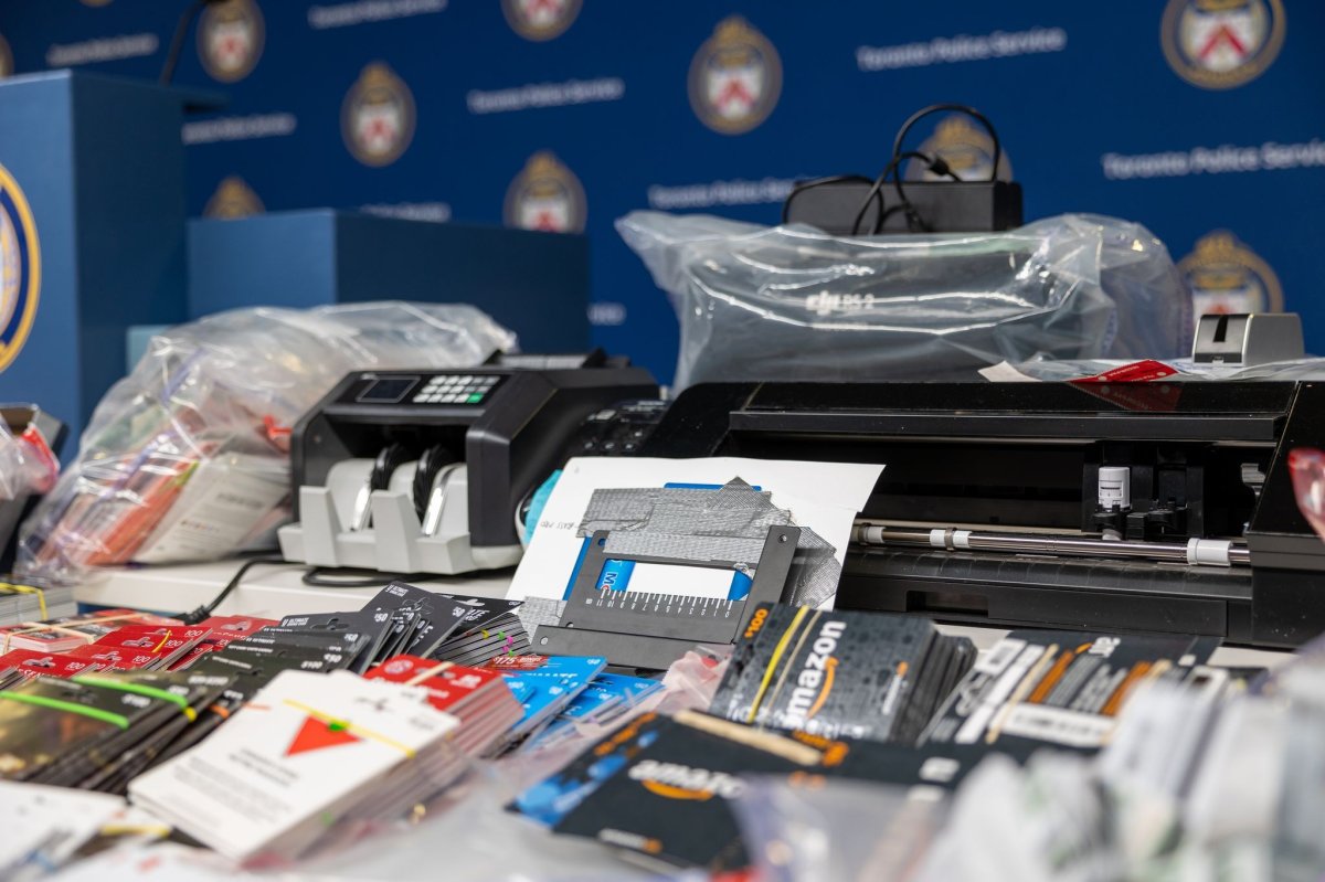 Gift cards and equipment seized by Toronto police on display.