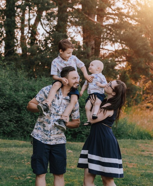 Jennifer Ferger with her husband, stepson and son born in April 2021.