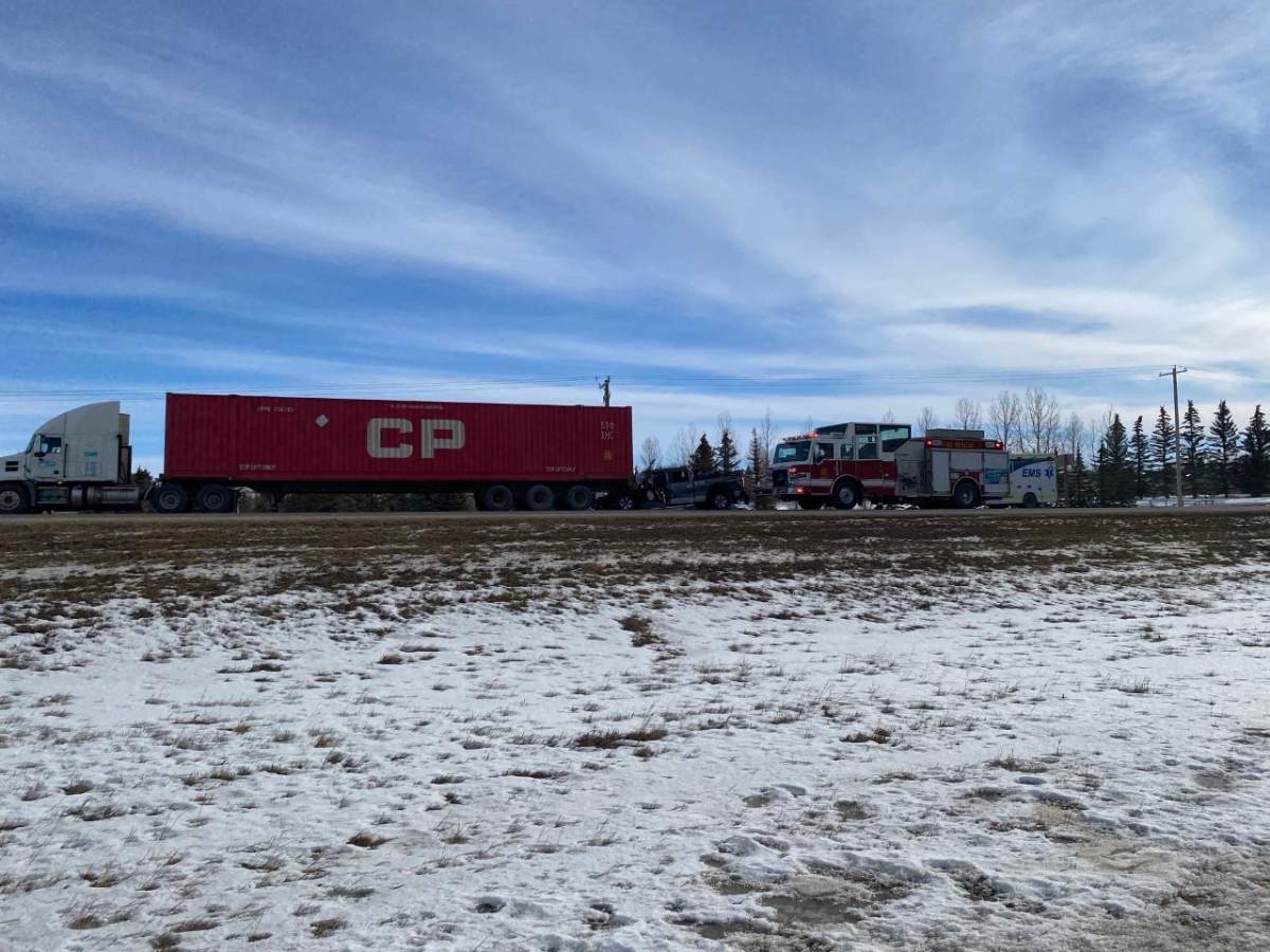 Emergency crews attend a crash near Okotoks, Alta., on Feb. 9, 2023.