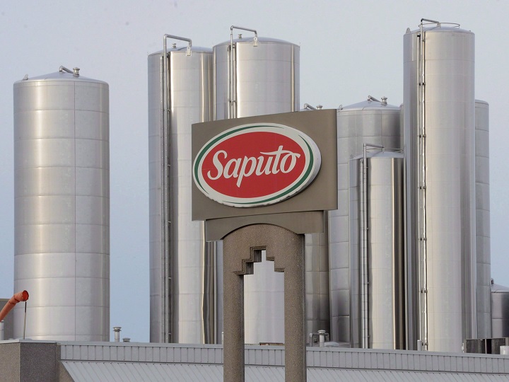 Dairy giant Saputo Inc. has announced sweeping changes to its U.S. operations, saying it will permanently close three facilities, build a new packaging facility and expand string cheese operations. A sign at a Montreal Saputo plant is shown on Jan.13, 2014.