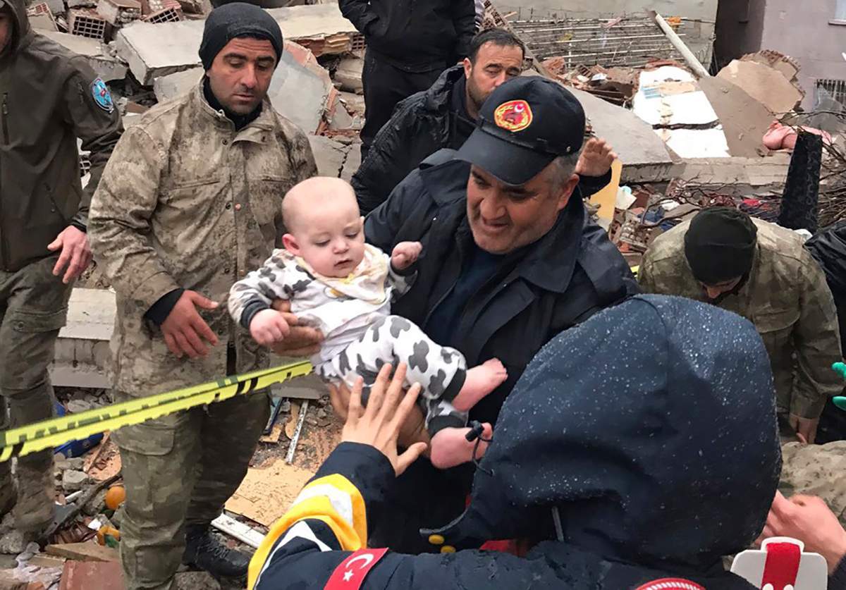 A baby is rescued from a destroyed building in Malatya, Turkey.