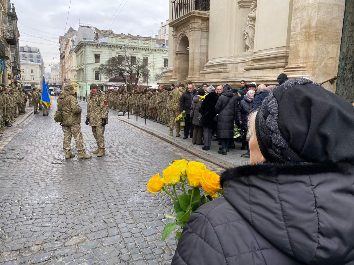 Mourner outside funeral for soldier at military church in Lviv, Ukraine, January 16, 2023.