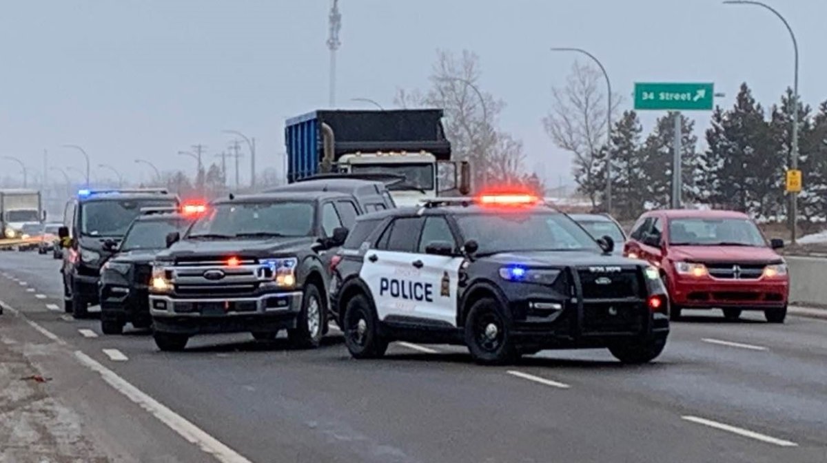 Edmonton police vehicles seen at Whitemud Drive between 17 Street and 34 Street on March 21, 2023.