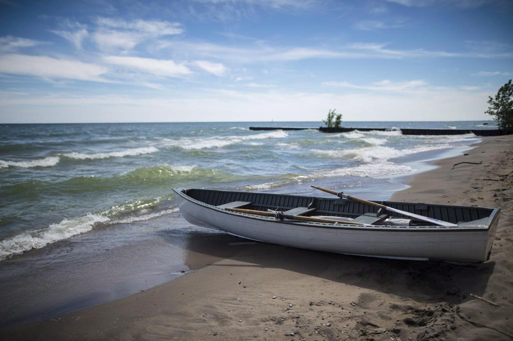 A lifeboat sits along the Gibraltar Point Beach on Toronto Island on Thursday, June 21, 2018. The City of Toronto has dropped plans for a formal event space near Hanlan’s Point Beach in response to concerns it could jeopardize the LGBTQ space on Toronto Island Park. THE CANADIAN PRESS/ Tijana Martin

.