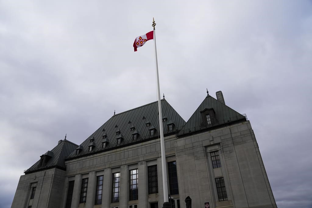The flag of the Supreme Court of Canada flies on the east flag pole in Ottawa, on Monday, Nov. 28, 2022. 