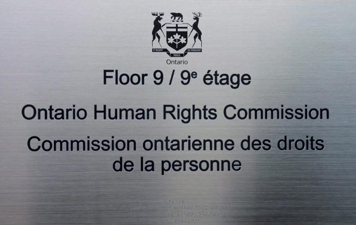 A plaque identifying the Ontario Human Rights Commission is seen at the entrance to its headquarters on Monday, Feb. 23, 2015. Canada's largest school board has voted in favour of asking the Ontario Human Rights Commission to create a plan that would address caste oppression in the public education system.  .
