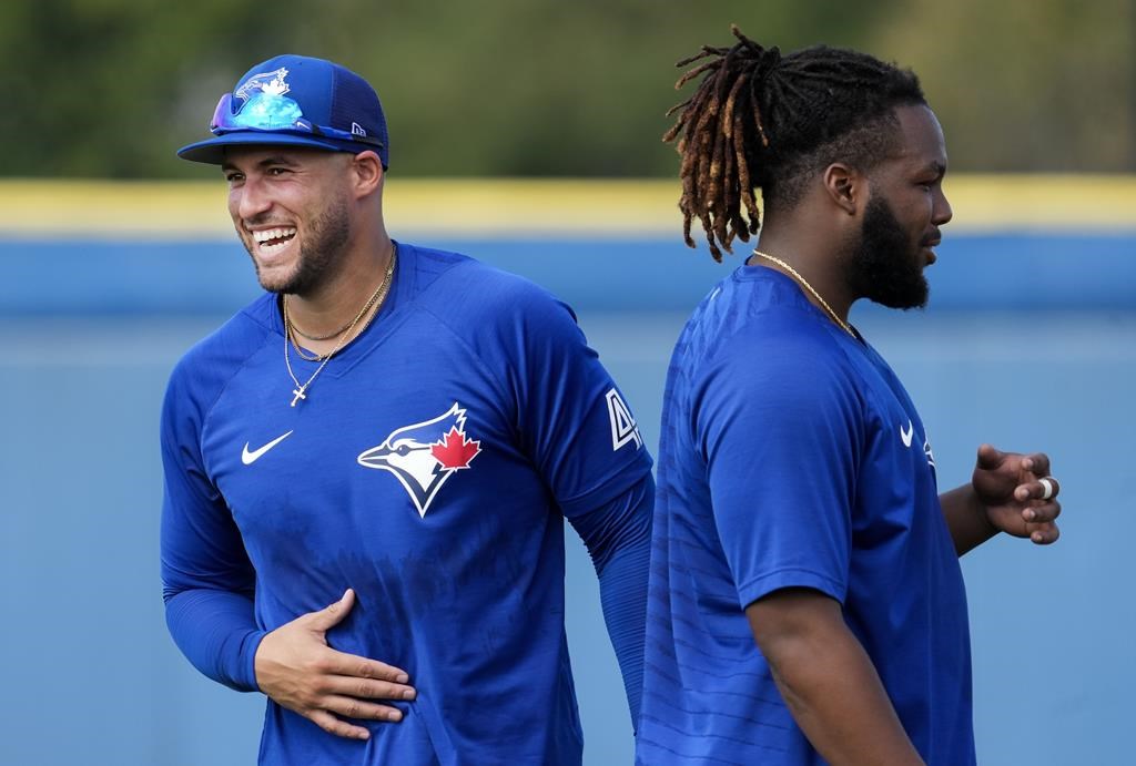 Toronto Blue Jays second baseman Cavan Biggio (8) throws to first base  during a spring training baseball game against the Baltimore Orioles on  March 1, 2023 at Ed Smith Stadium in Sarasota