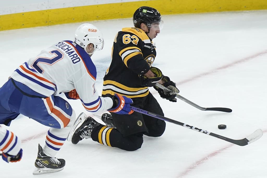 NHL referee takes out Bruins' Brad Marchand with surprise check in