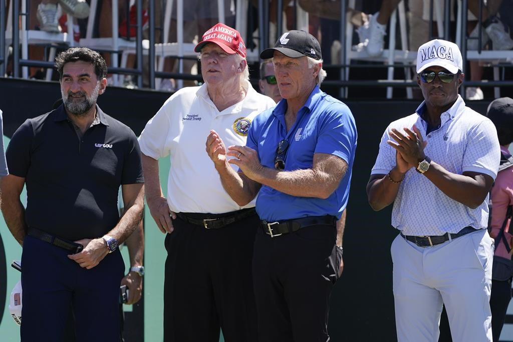 (From left to right) Yasir Al-Rumayyan, governor of Saudi Arabia’s Public Investment Fund, former U.S. president Donald Trump, Greg Norman, LIV Golf CEO and Majed Al-Sorour, CEO of Golf Saudi, watch the start of the second round of the Bedminster Invitational LIV Golf tournament in Bedminster, N.J., July 30, 2022.