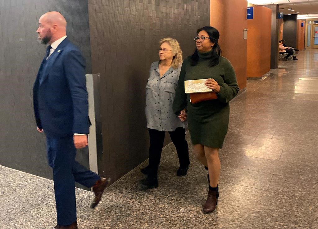 Sandra Helm walks in the hallway at the Montreal courthouse in Montreal on Tuesday, January 18, 2023. The U.S. woman who was kidnapped along with her husband and smuggled into Quebec in October 2020 says she still lives in constant fear something will happen to her. THE CANADIAN PRESS/Sidhartha Banerjee.