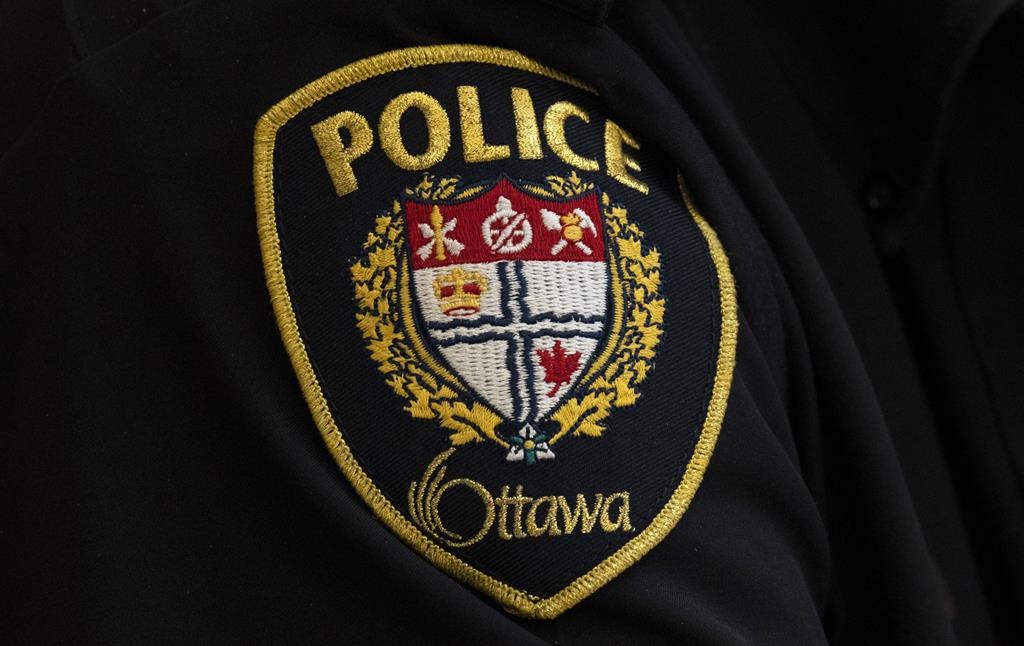 A close-up of an Ottawa Police officer’s badge is seen in Ottawa, Thursday, April 28, 2022. Ottawa's Mayor has put out a statement after public backlash over photos of the Ottawa Police Service wearing a 'thin blue line' symbol on their hockey jerseys at a charity game on March 10. THE CANADIAN PRESS/Adrian Wyld.
