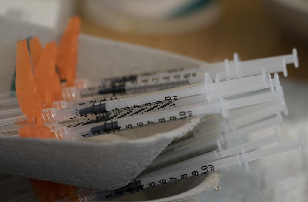 Needles are seen filled with the vaccination for COVID-19 at a truck stop on highway 91 North in Delta, B.C., Wednesday, June 16, 2021.