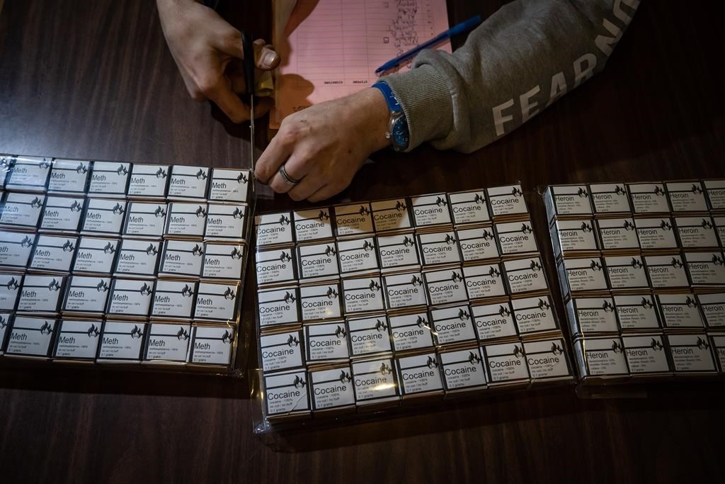 Toronto is asking the federal government to decriminalize all drugs for personal use in the city and for all people, including youth, as it lays out a model that goes further than what Health Canada approved in British Columbia. A tested supply of cocaine, heroin and methamphetamine is readied for distribution to drug users n Vancouver, on Wednesday, February 9, 2022. THE CANADIAN PRESS/Darryl Dyck.