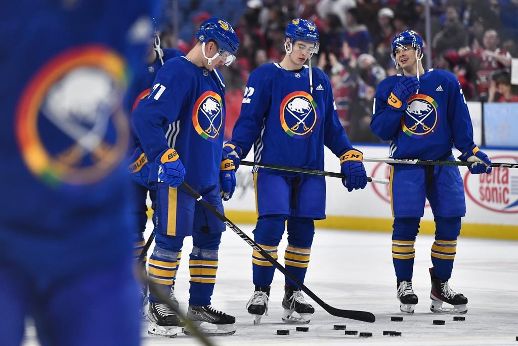 Buffalo Sabres left wing Victor Olofsson, left, right wing Jack Quinn and right wing JJ Peterka wear special warmup jerseys commemorating Pride Night before an NHL hockey game against the Montreal Canadiens in Buffalo, N.Y., Monday, March 27, 2023.