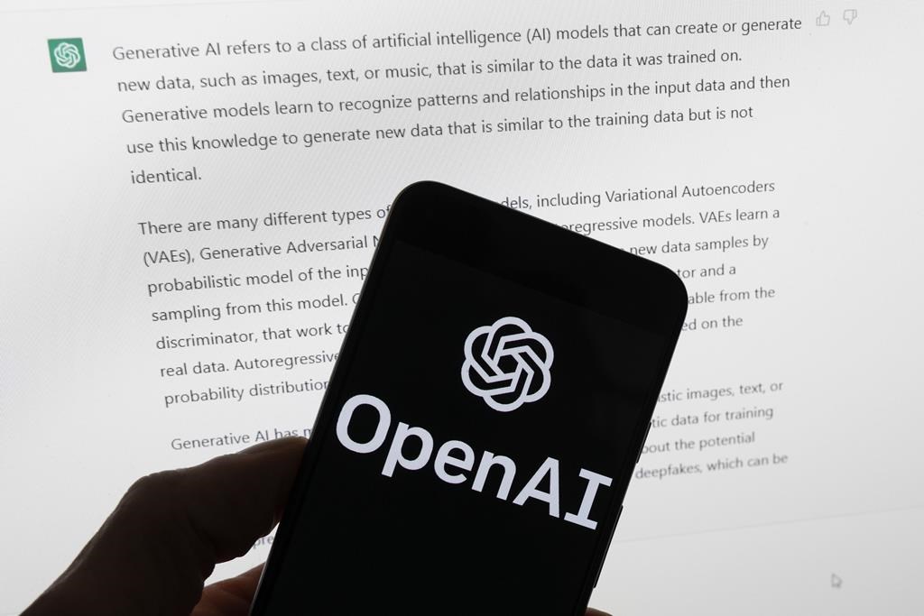 FILE - The OpenAI logo is seen on a mobile phone in front of a computer screen displaying output from ChatGPT, Tuesday, March 21, 2023, in Boston. Are tech companies moving too fast in rolling out powerful artificial intelligence technology that could one day outsmart humans? That is the conclusion of a group of prominent computer scientists and other tech industry notables who are calling for a 6-month pause to consider the risks. Their petition published Wednesday, March 29, 2023, is a response to San Francisco startup OpenAI's recent release of GPT-4. (AP Photo/Michael Dwyer, File).