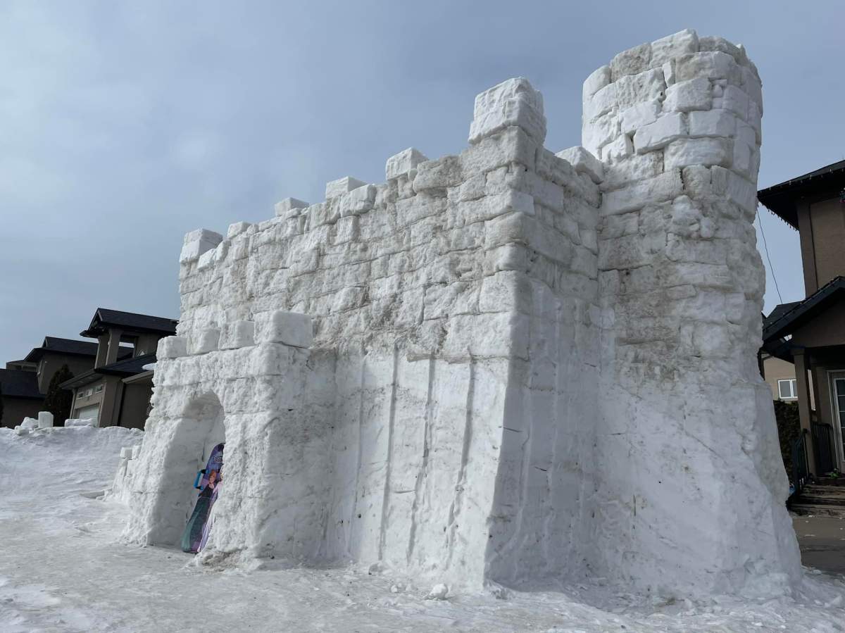 Jason Greer built a 15 foot tall snow castle with slide in his front year in Saskatoon.