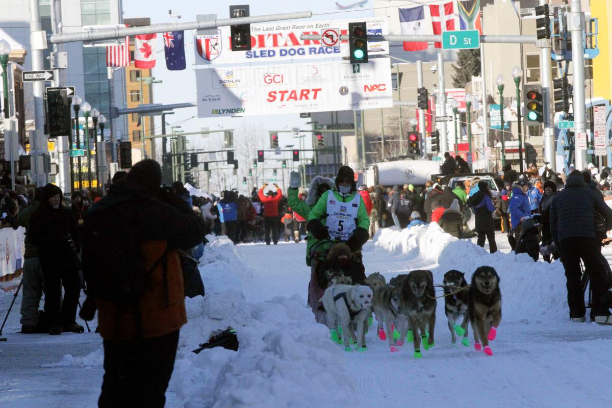 Ryan Redington, whose grandfather Joe Redington Sr. helped start the Iditarod in 1973, mushes down Fourth Avenue during the Iditarod Trail Sled Dog Race's ceremonial start in downtown Anchorage, Alaska, on Saturday, March 4, 2023.