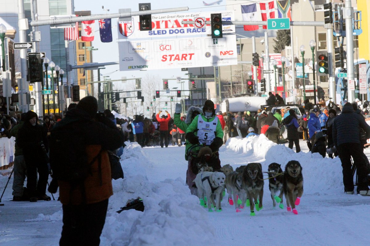 Ryan Redington, whose grandfather Joe Redington Sr. helped start the Iditarod in 1973, mushes down Fourth Avenue during the Iditarod Trail Sled Dog Race's ceremonial start in downtown Anchorage, Alaska, on Saturday, March 4, 2023.