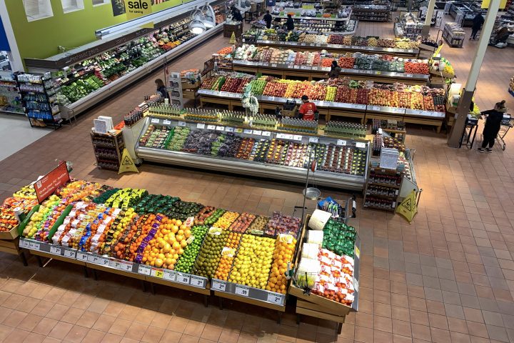 Aisles of produce in a grocery store are seen from above