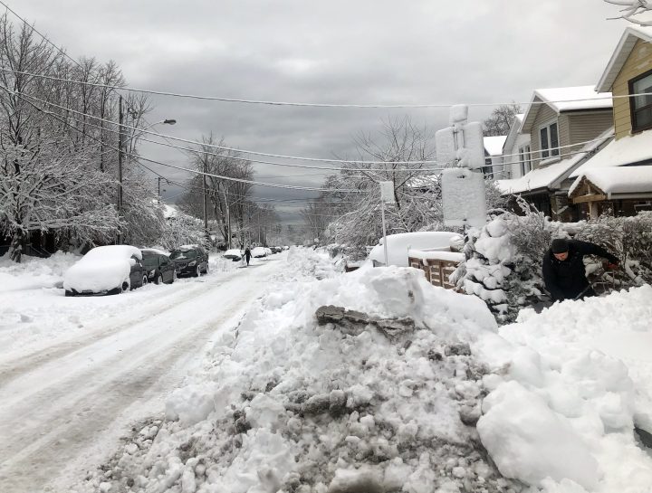 A man shovels snow after a fierce winter storm brought heavy snow, strong winds and even thunder and lightning to most of southern Ontario. Toronto, Ont., Saturday, March 4, 2023.