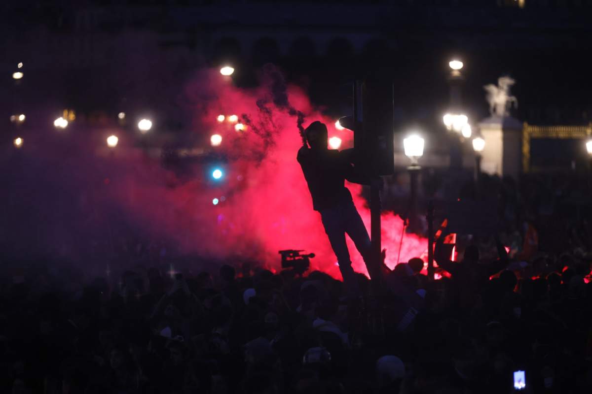 Protesters demonstrate at Concorde square near the National Assembly in Paris, Thursday, March 16, 2023.