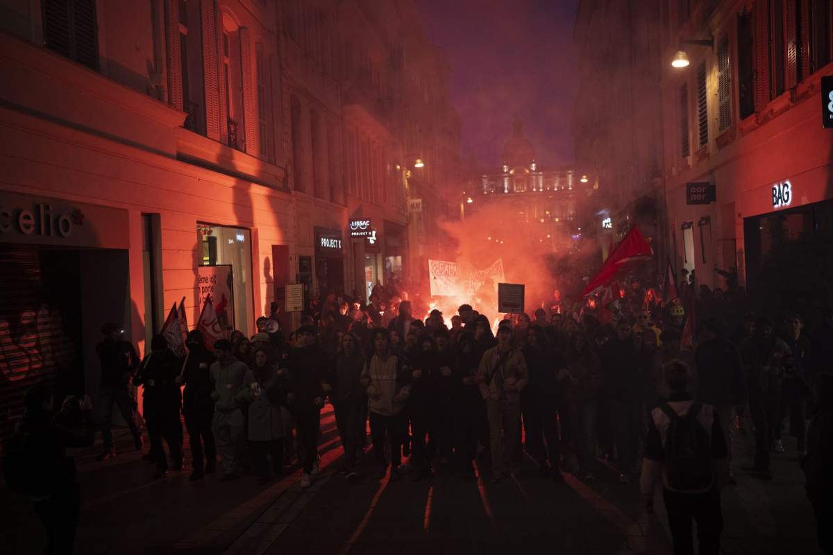 Protesters march during a demonstration in Marseille, southern France, Thursday, March 16, 2023.
