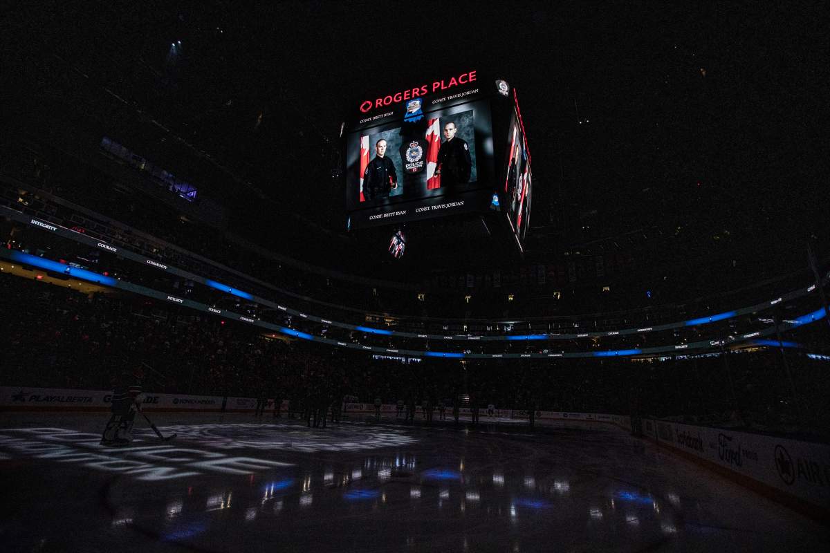 Edmonton Police Const. Brett Ryan and Const. Travis Jordan, who were shot and killed responding to a domestic violence call are given a moment of silence before the Dallas Stars and Edmonton Oilers game in Edmonton on Thursday March 16, 2023.