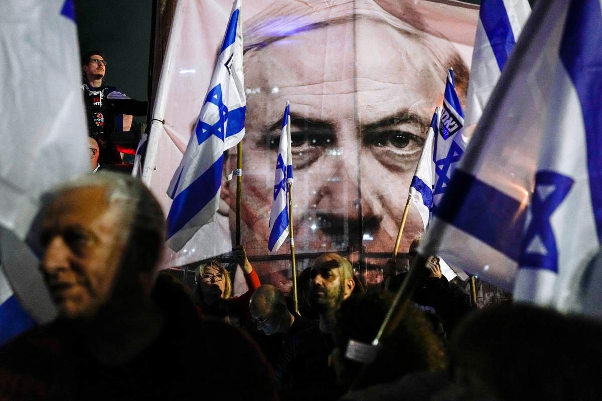 Israelis protest Saturday against plans by Prime Minister Benjamin Netanyahu’s government to overhaul Israel’s judicial system, in Tel Aviv, Israel. (AP Photo/Ohad Zwigenberg)