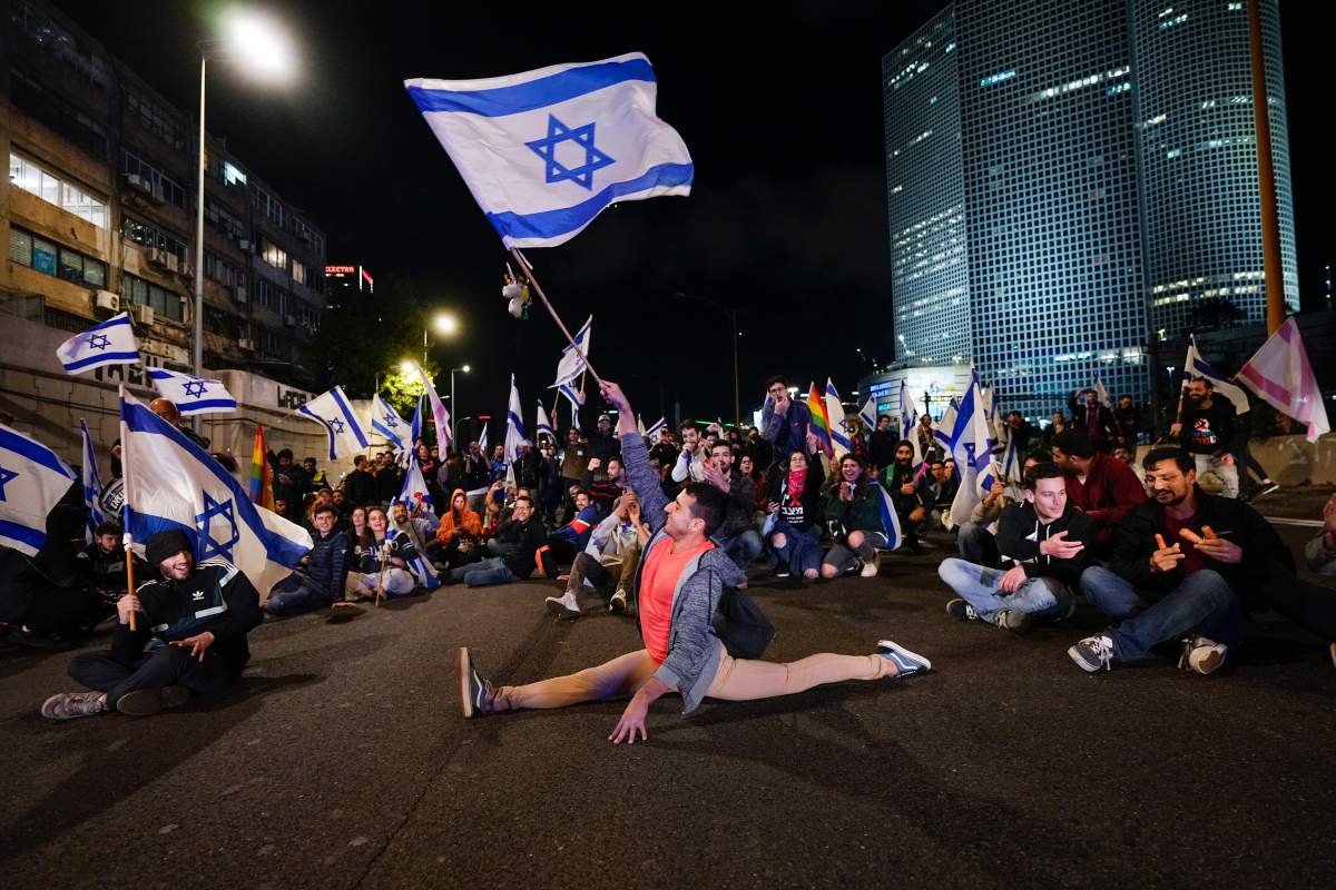 Demonstrators block a highway during a protest Saturday against plans by Prime Minister Benjamin Netanyahu’s government to overhaul Israel’s judicial system, in Tel Aviv, Israel. (AP Photo/Ohad Zwigenberg)