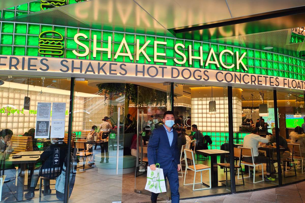 Citizens are seen at a Shake Shack burger restaurant in Shanghai, China, December 8, 2022.