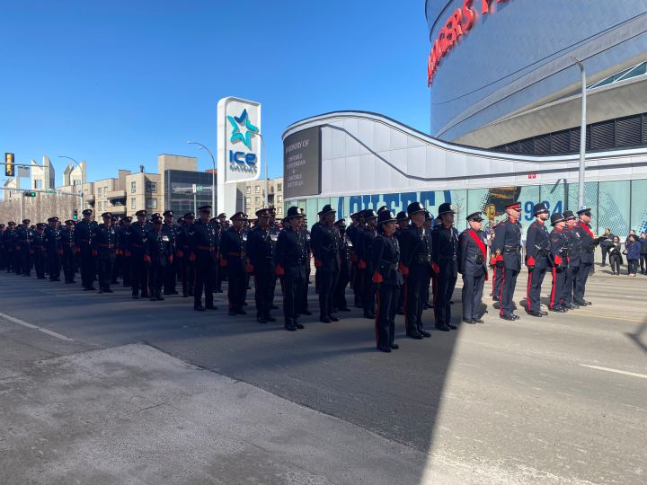 Members of the Calgary Police Service outside Rogers Place on March 27, 2023 where a funeral was being held for two slain Edmonton police officers.