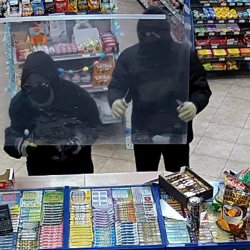 Waterloo police want to identify the two men in the photo in an investigation into an armed robbery in Cambridge.
