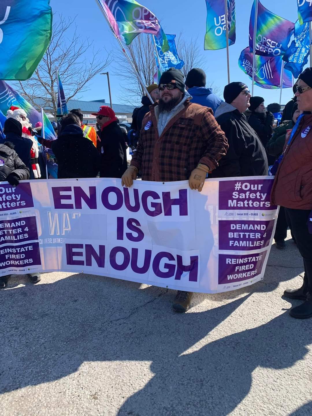 OPSEU union members rallying outside the Community Living Association of South Simcoe facility in Allston to protest the firming of three workers on Tuesday, March 7, 2023.