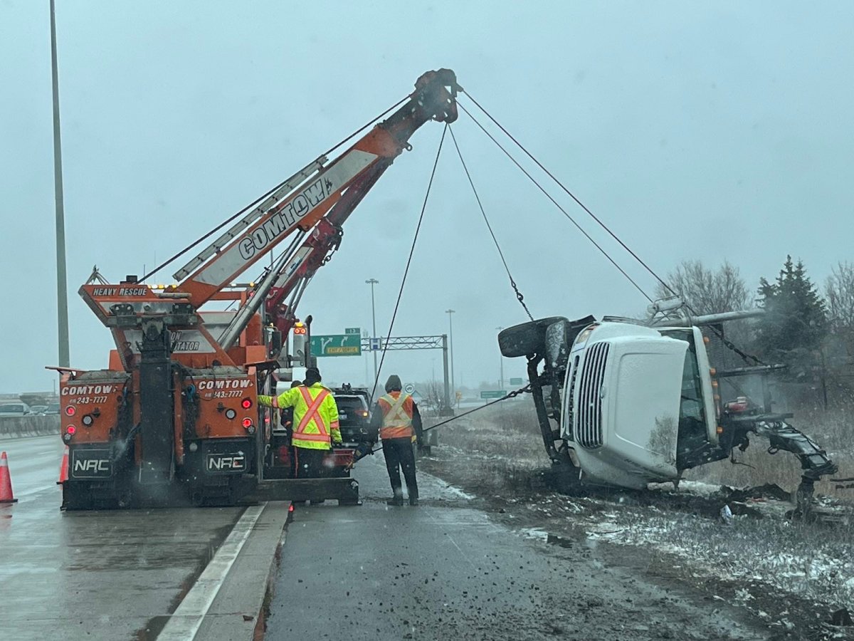 Police are investigating after a crane truck rolled over along Highway 410.