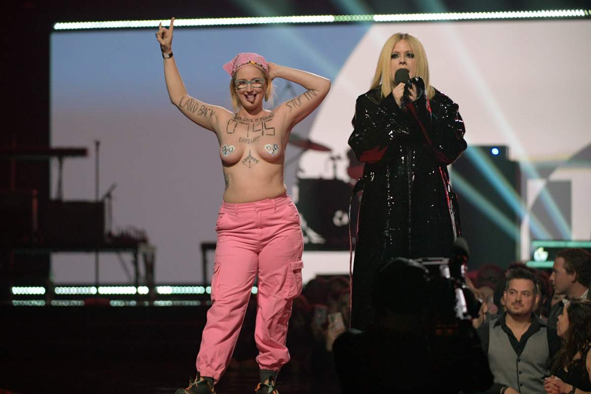 Protestor Ever Hatherly, 37, (legal name Casey Hatherly) interrupts Avril Lavigne speaking onstage at the 2023 JUNO Awards at Rogers Place on March 13, 2023 in Edmonton, Canada.