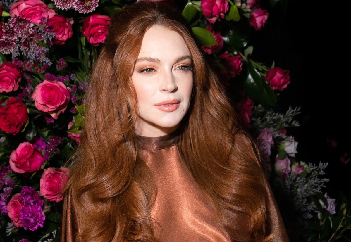 Lindsay Lohan in a silk, salmon coloured outfit.