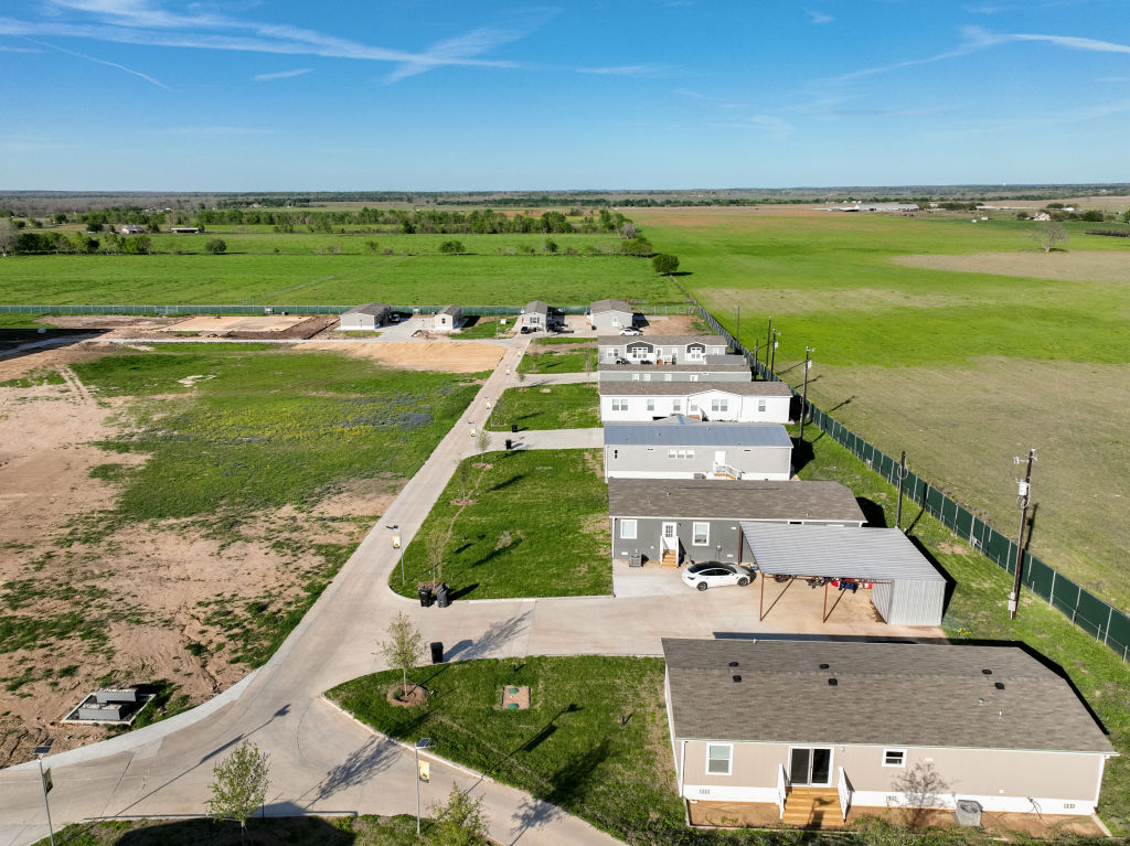 An aerial view of Elon Musk's Snailbrook community under construction on March 13, 2023 in Bastrop County, Texas. Elon Musk has reportedly bought thousands of acres of land in a plan to build a town where employees could live and work.