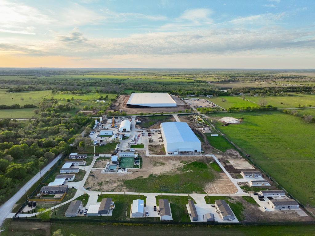 An aerial view of Elon Musk's Snailbrook community under construction on March 13, 2023 in Bastrop County, Texas. Elon Musk has reportedly bought thousands of acres of land in a plan to build a town where employees could live and work.