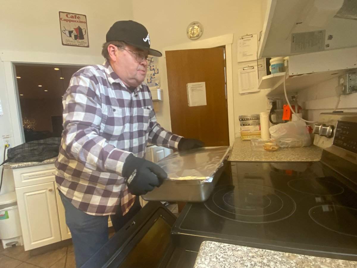 Volunteer Roy getting meals ready in the Fusion Church kitchen, Sunday, March 26, 2023. 