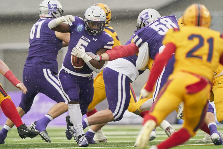 Western Mustangs' Keon Edwards runs the ball against the Queen’s Golden Gaels during first half OUA Yates Cup university football action at Western University in London, Ont. on Saturday, November 12, 2022.