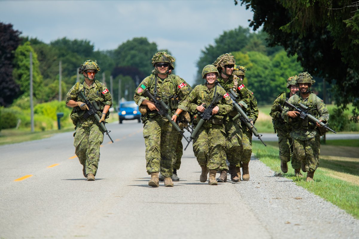 Members of 4th Battalion, The Royal Canadian Regiment conduct a fitness march at Cedar Springs, Ontario on July 16, 2022.