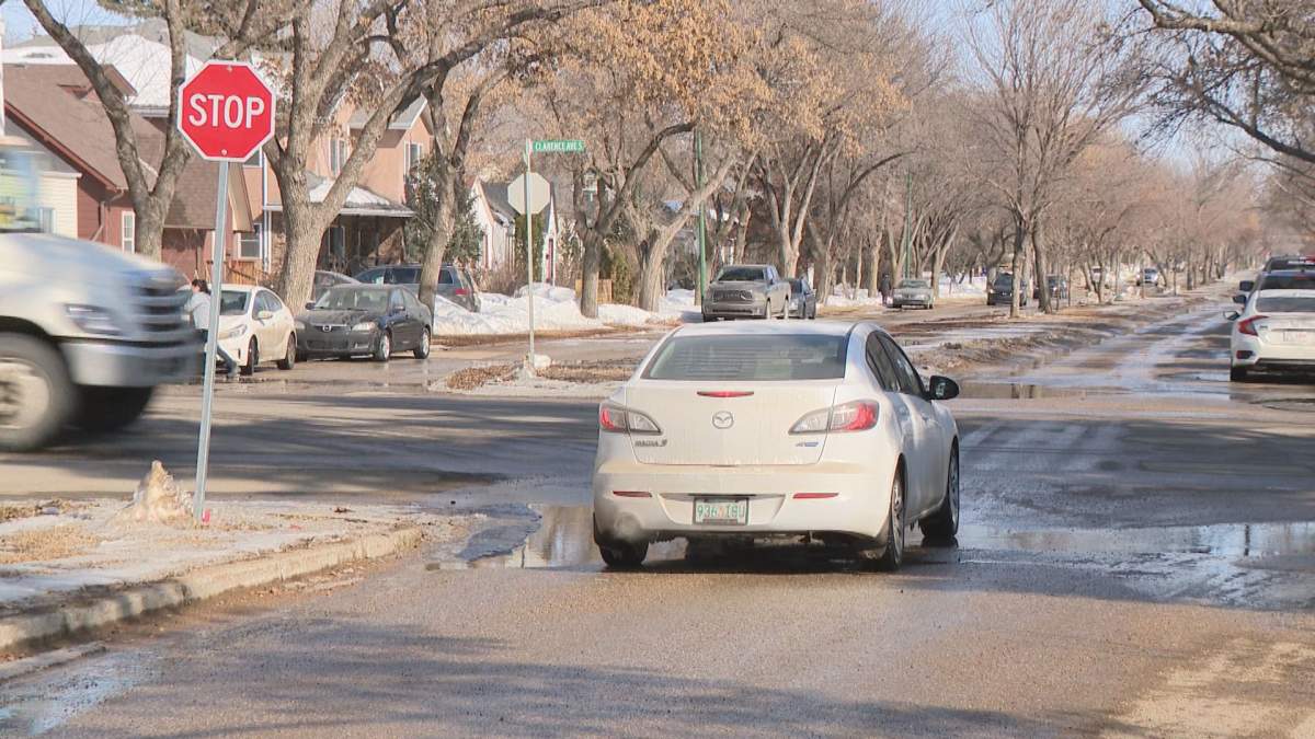 Car stopped at the intersection at Main Street and Clarence Ave.