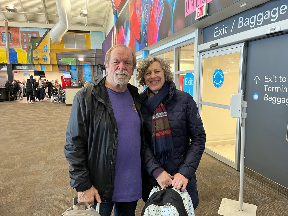 Danny Culhane and Paula Miziolek wait for their flight out west inside the London International Airport.