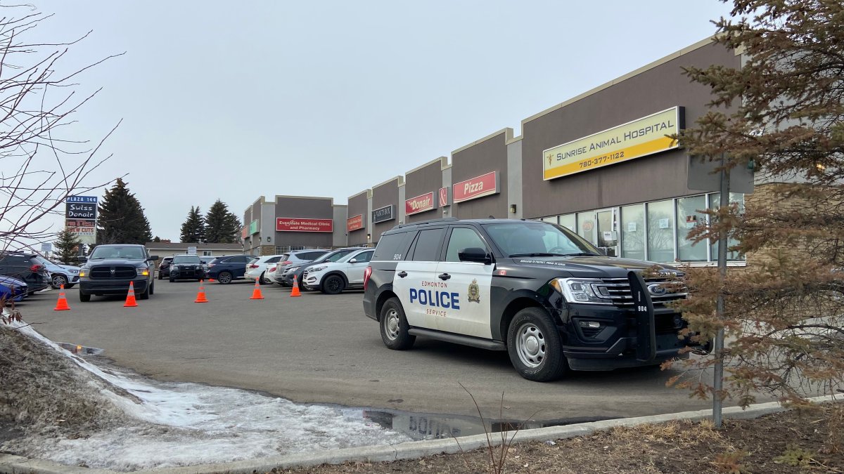 Edmonton police investigate an armed robbery at a pharmacy on the city's north side, Wednesday, March 29, 2023.